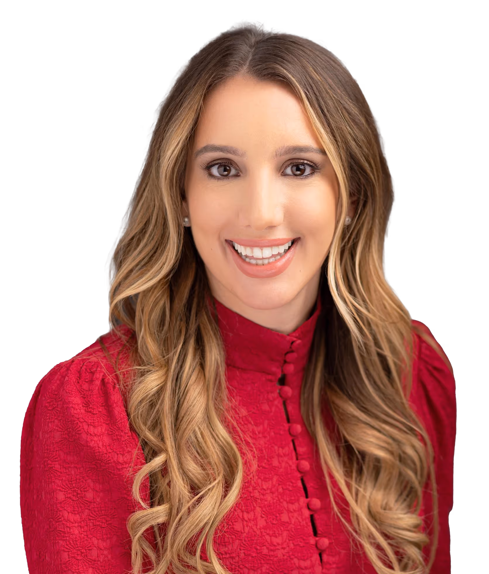 Woman in red blouse with wavy hair smiling brightly at camera
