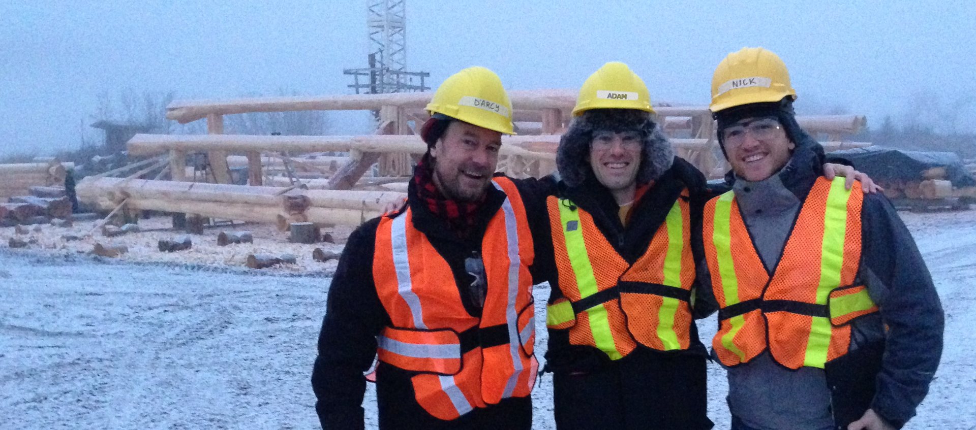 Adam Wilkenfeld with the Timber Kings crew on a snowy log home build site