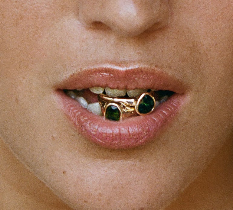 Jewelry held between teeth