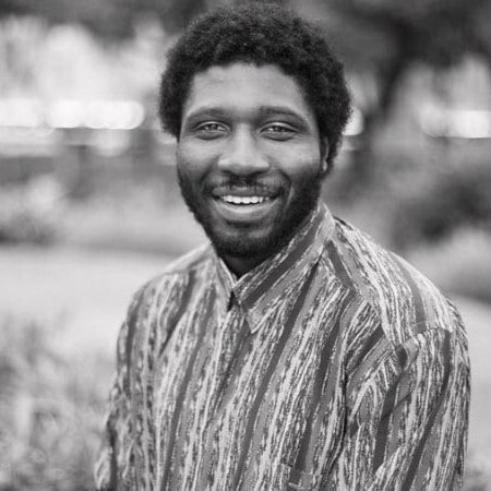 Black and white photo of a man smiling