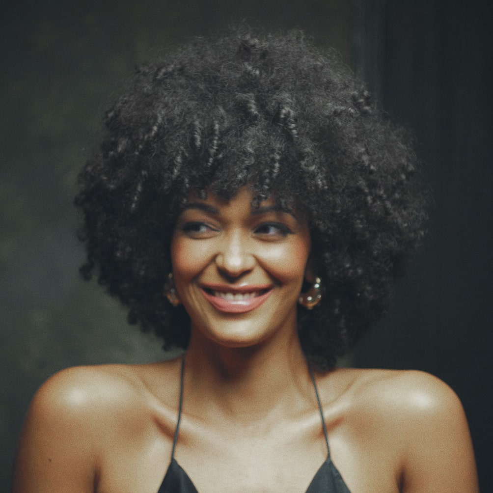 A portrait of a woman against a dark background