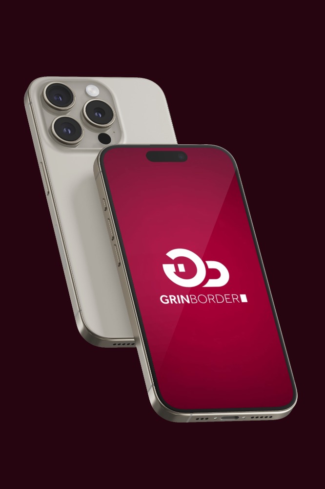 Two modern smartphones with one displaying a red screen featuring the white GrinBorder logo.