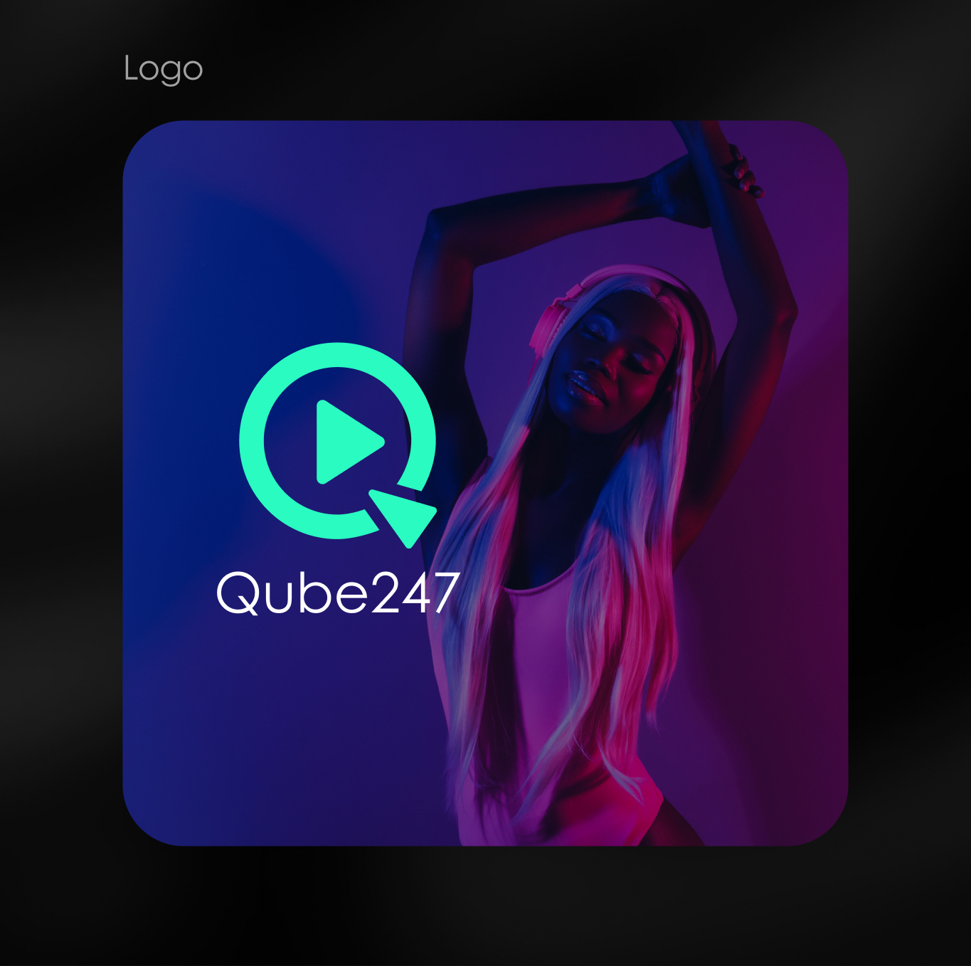 Woman with long blonde hair wearing headphones and a white top poses with arms raised against a purple and blue background with Qube247 logo and play button.