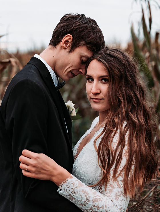 young-couple-standing-outdoors 1