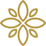 Symmetrical flower-shaped gold ornament with eight petals and small circular accents.