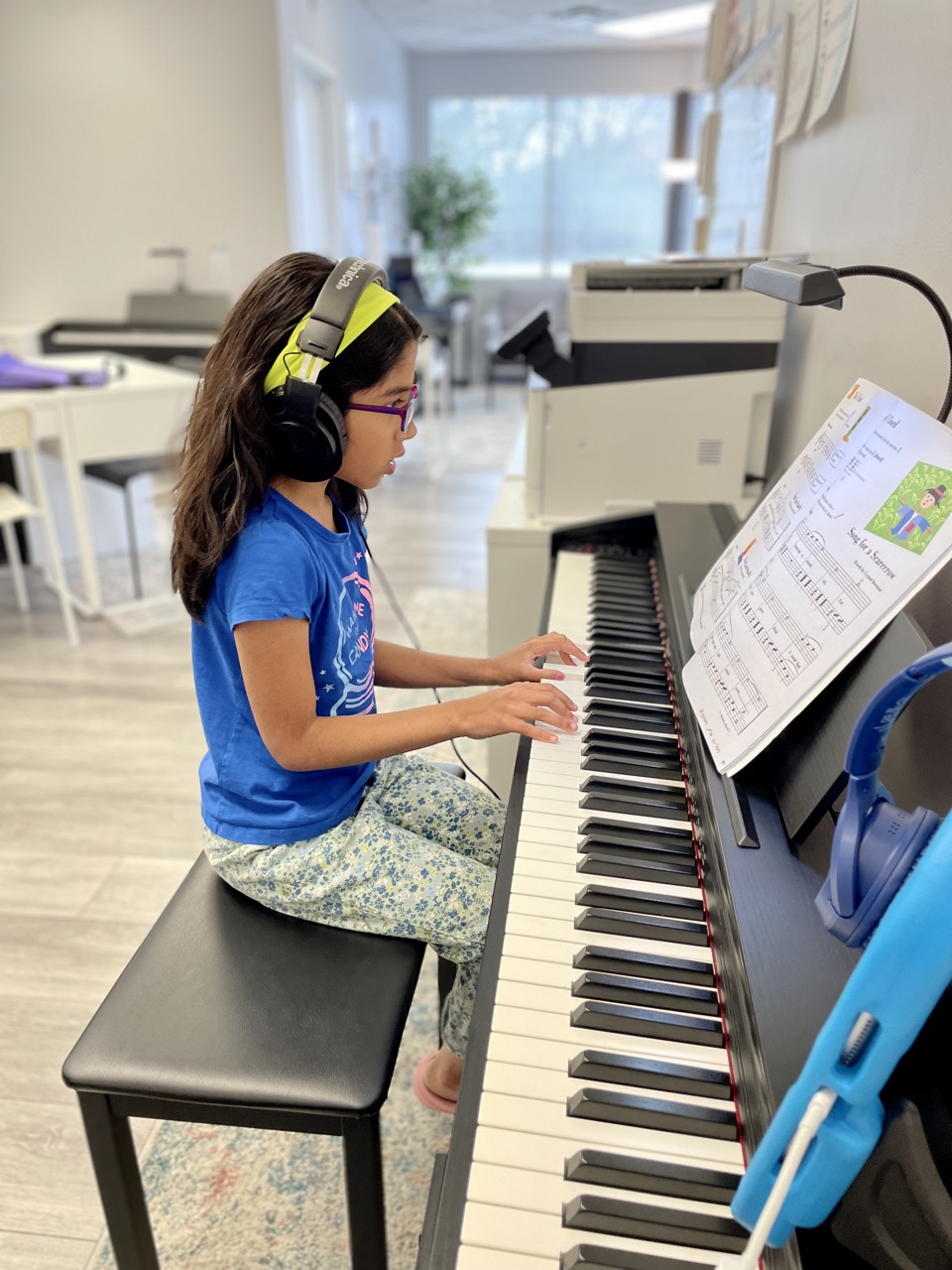 Group of kids at a piano lesson
