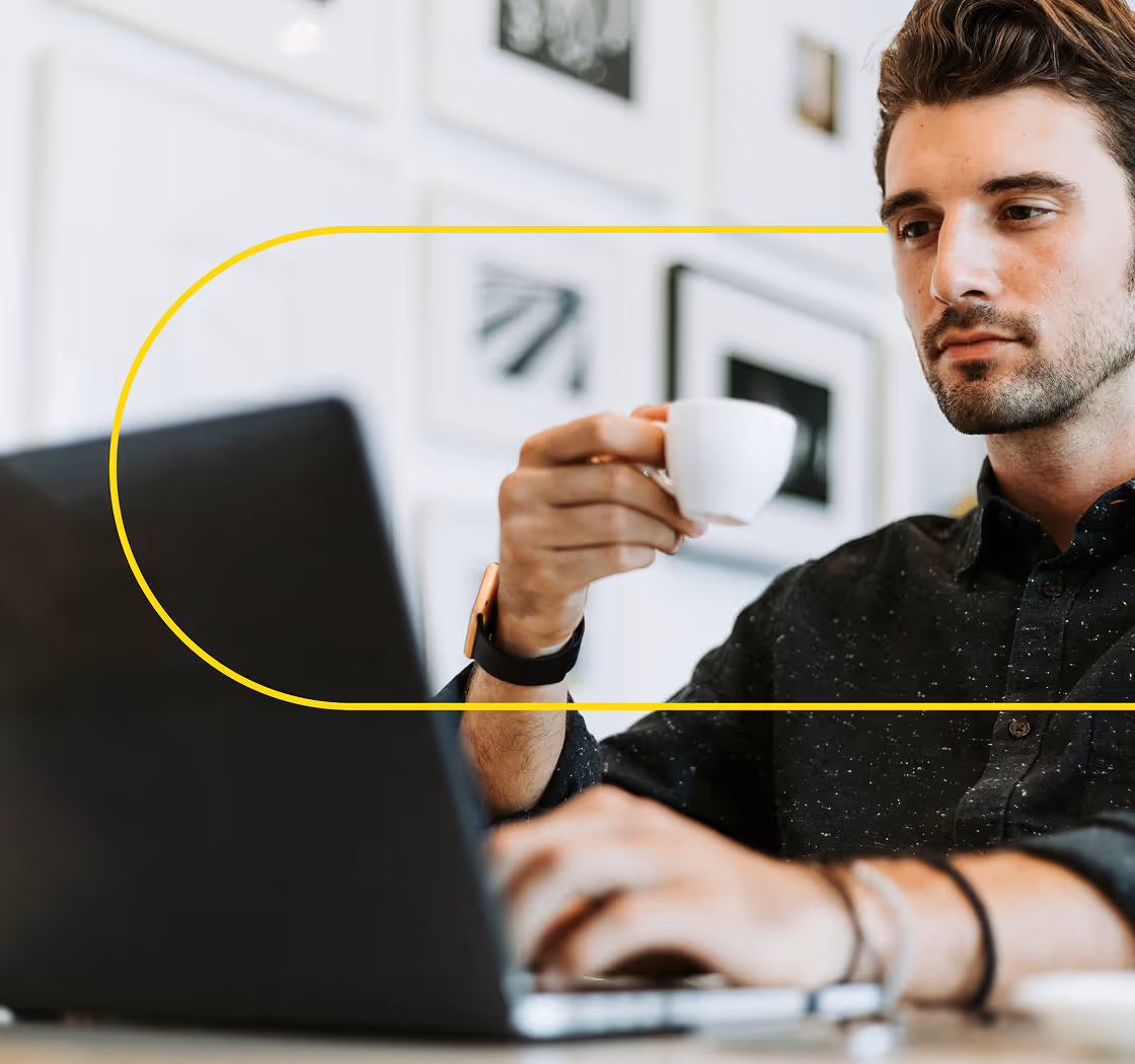 man working in the office and taking a coffee