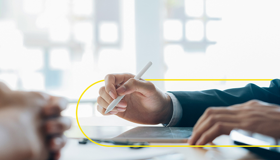 hand of a man holding a pencil