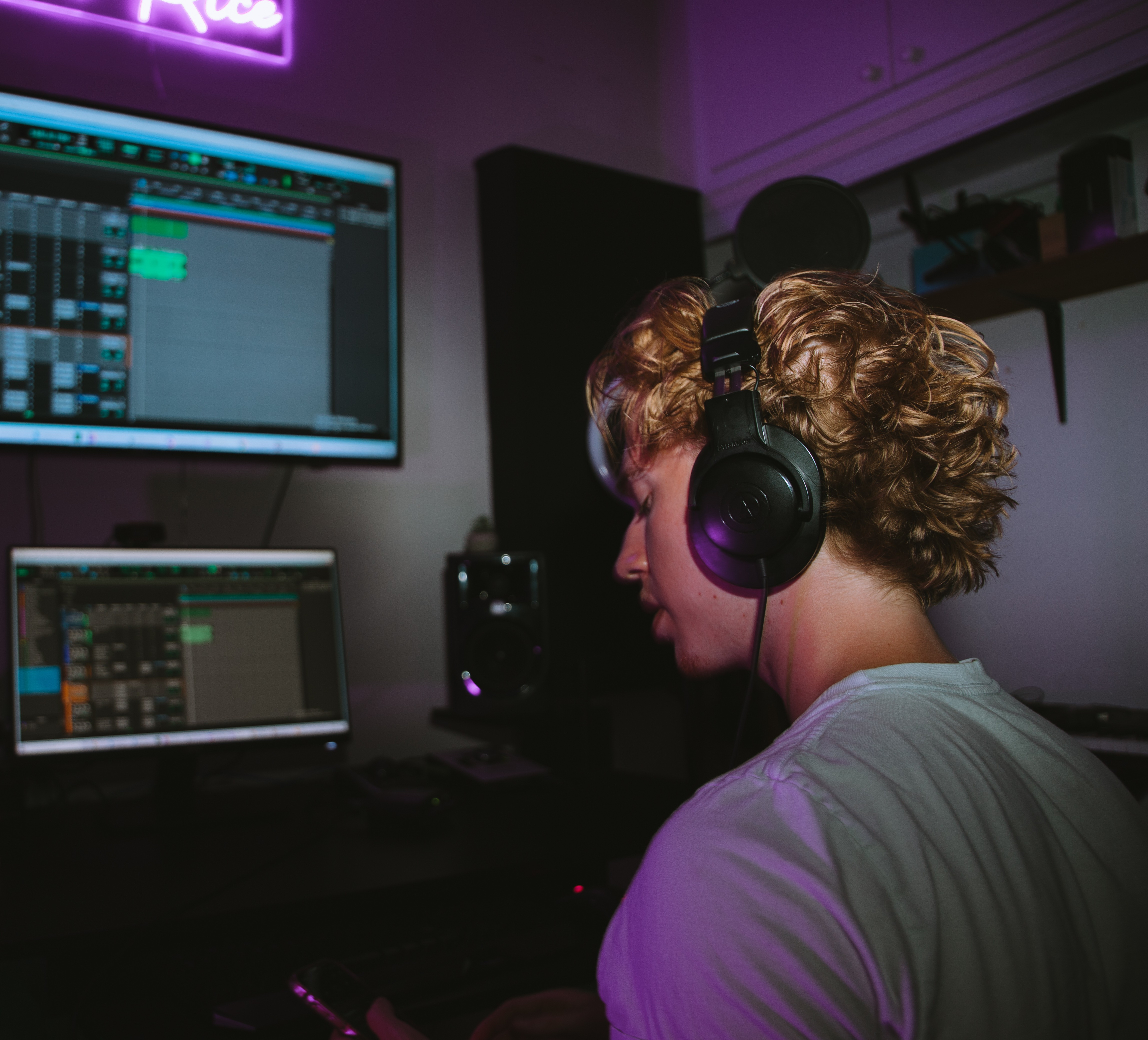 image of music producer at a console