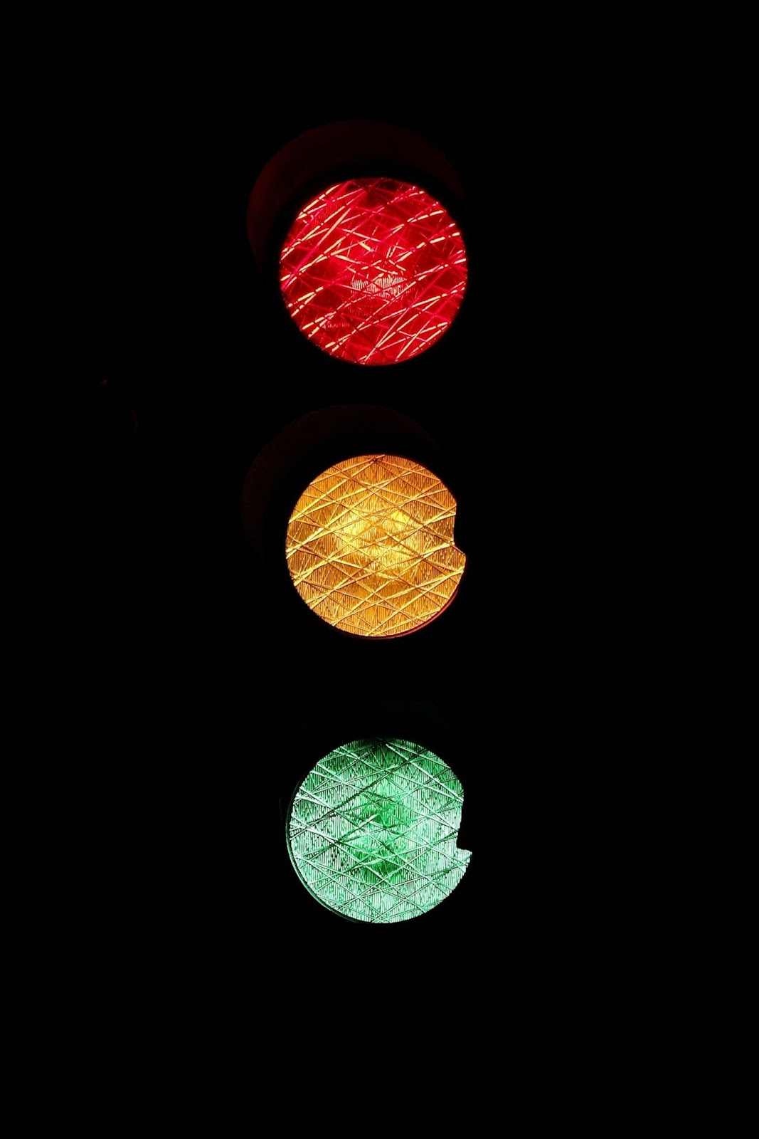 A close-up of a traffic lightAI-generated content may be incorrect.