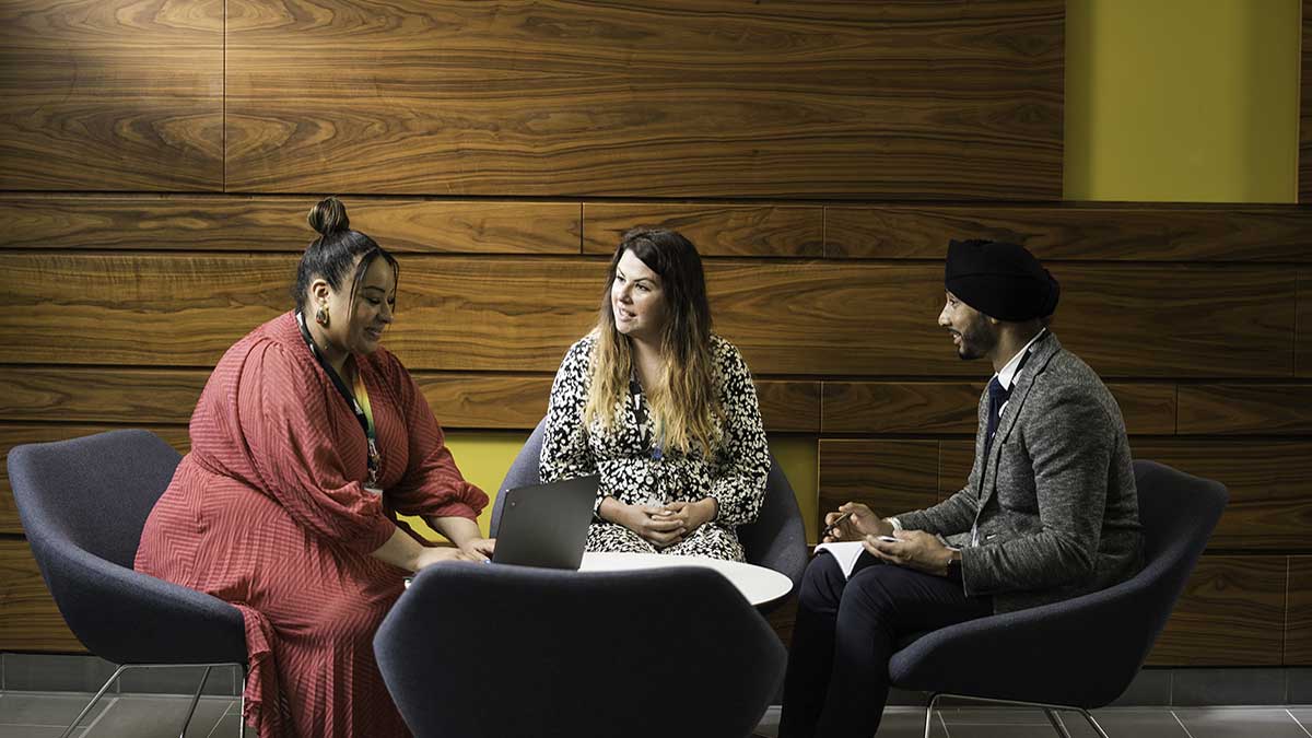 Network Rail employees having a meeting in the office.