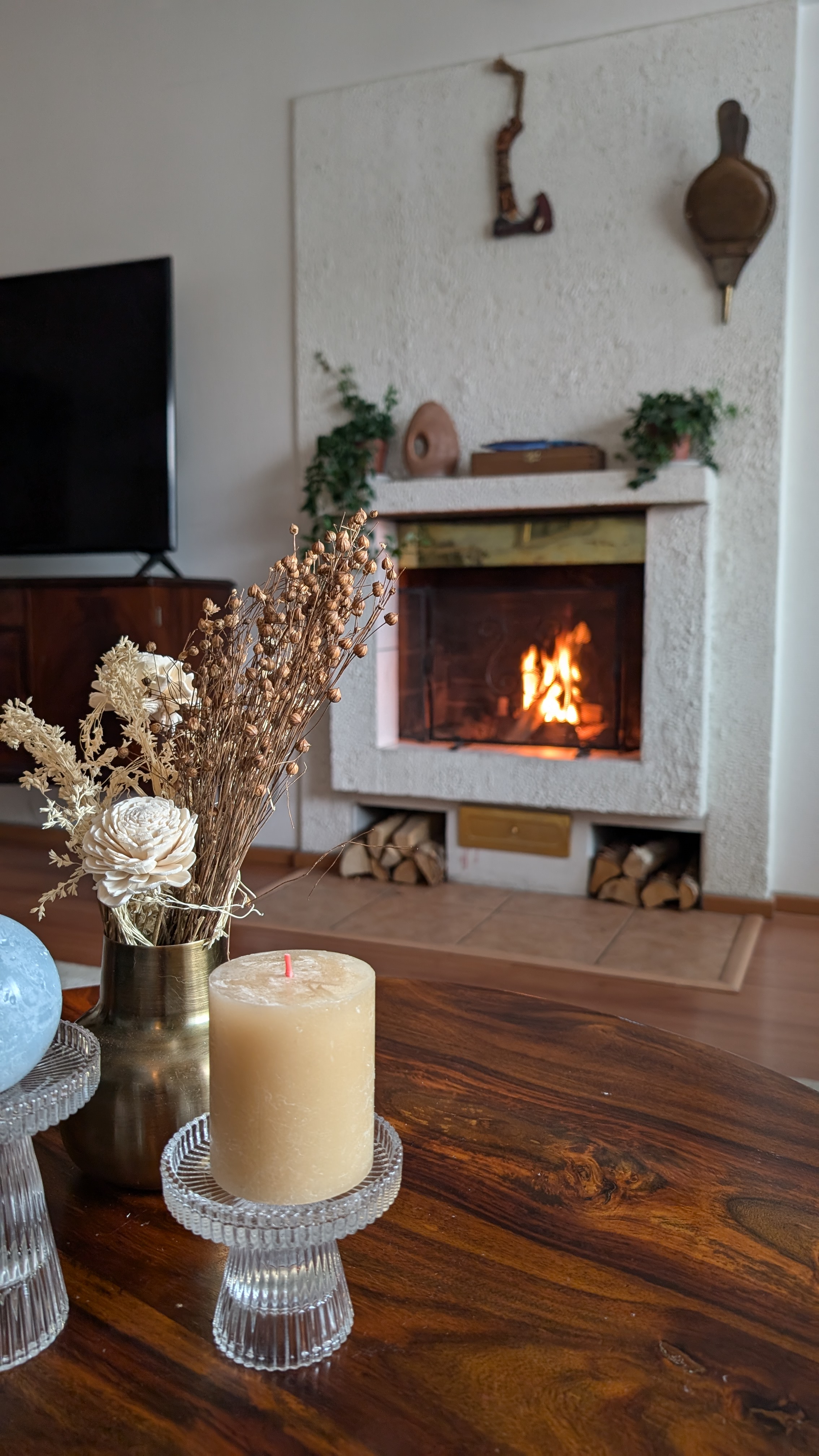 Fireplace with candles on a wooden coffee table in a cozy city apartment in Rovaniemi, Finland