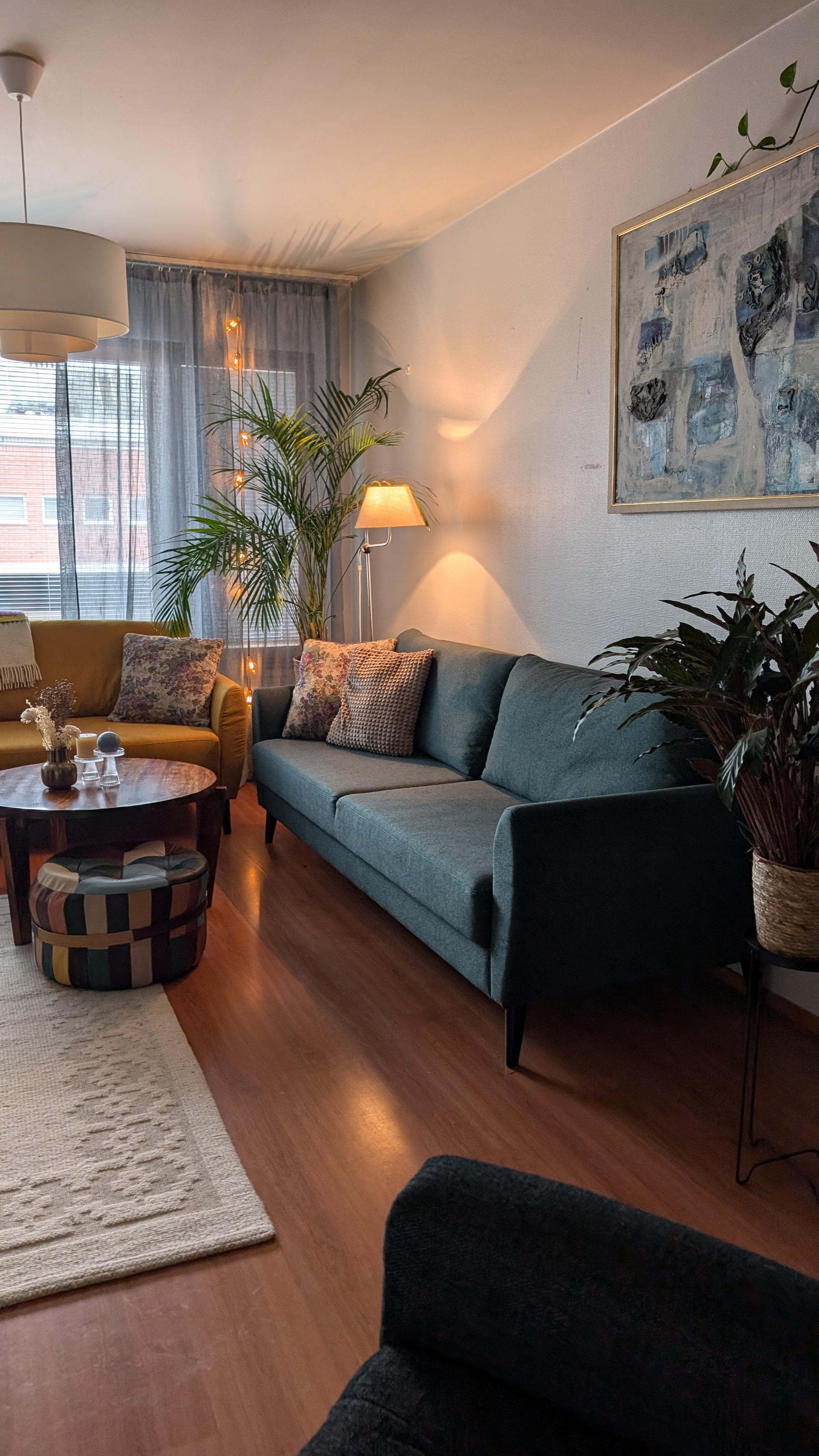 Large sofa with wooden coffee table in a cozy city apartment in Rovaniemi, Finland