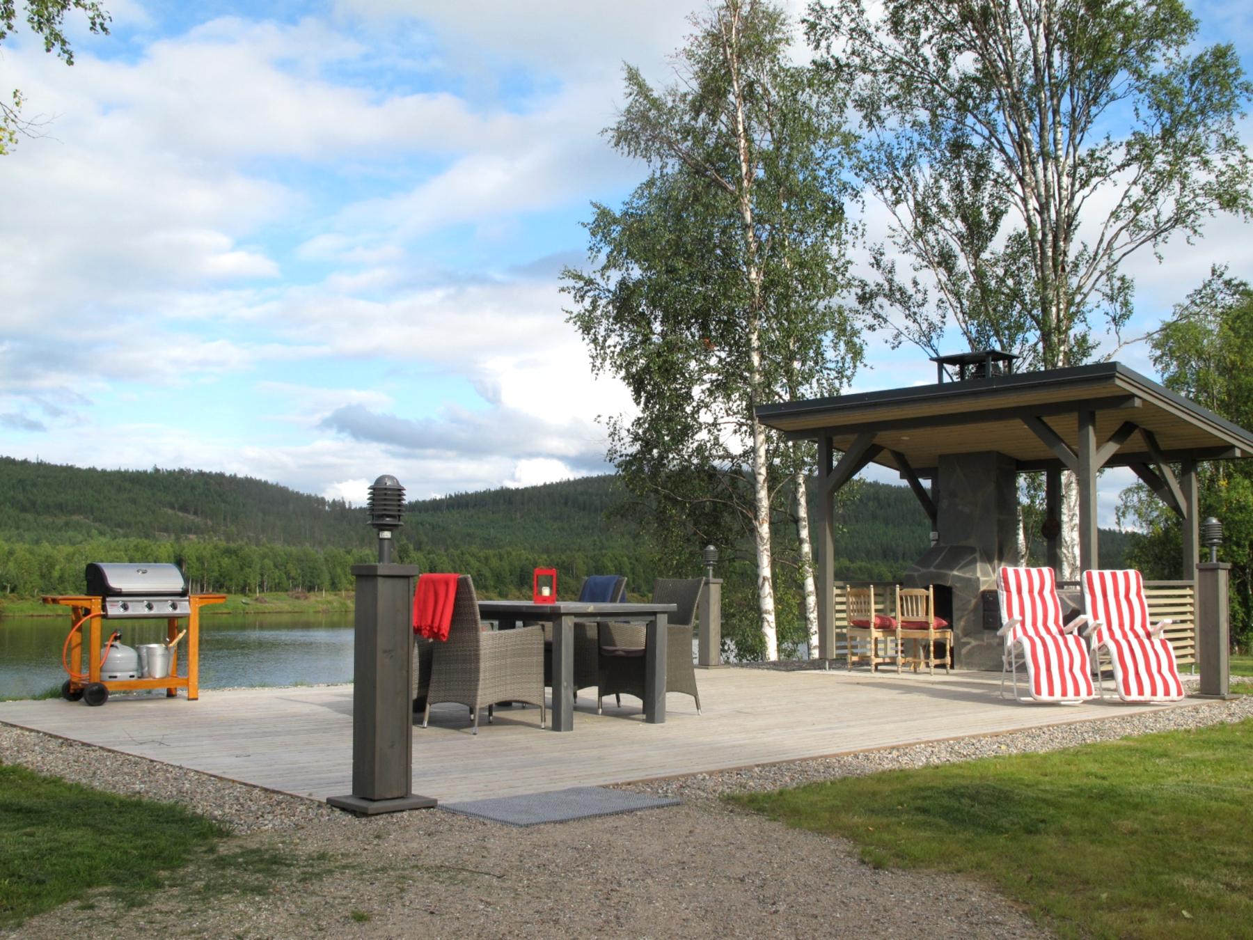 Sauna cottage with lake view and outdoor fireplace Lapland