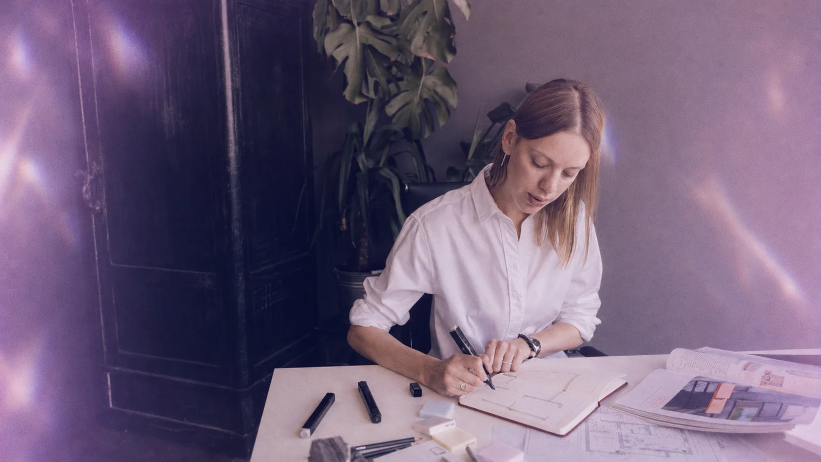 A behavior analyst planning at a desk