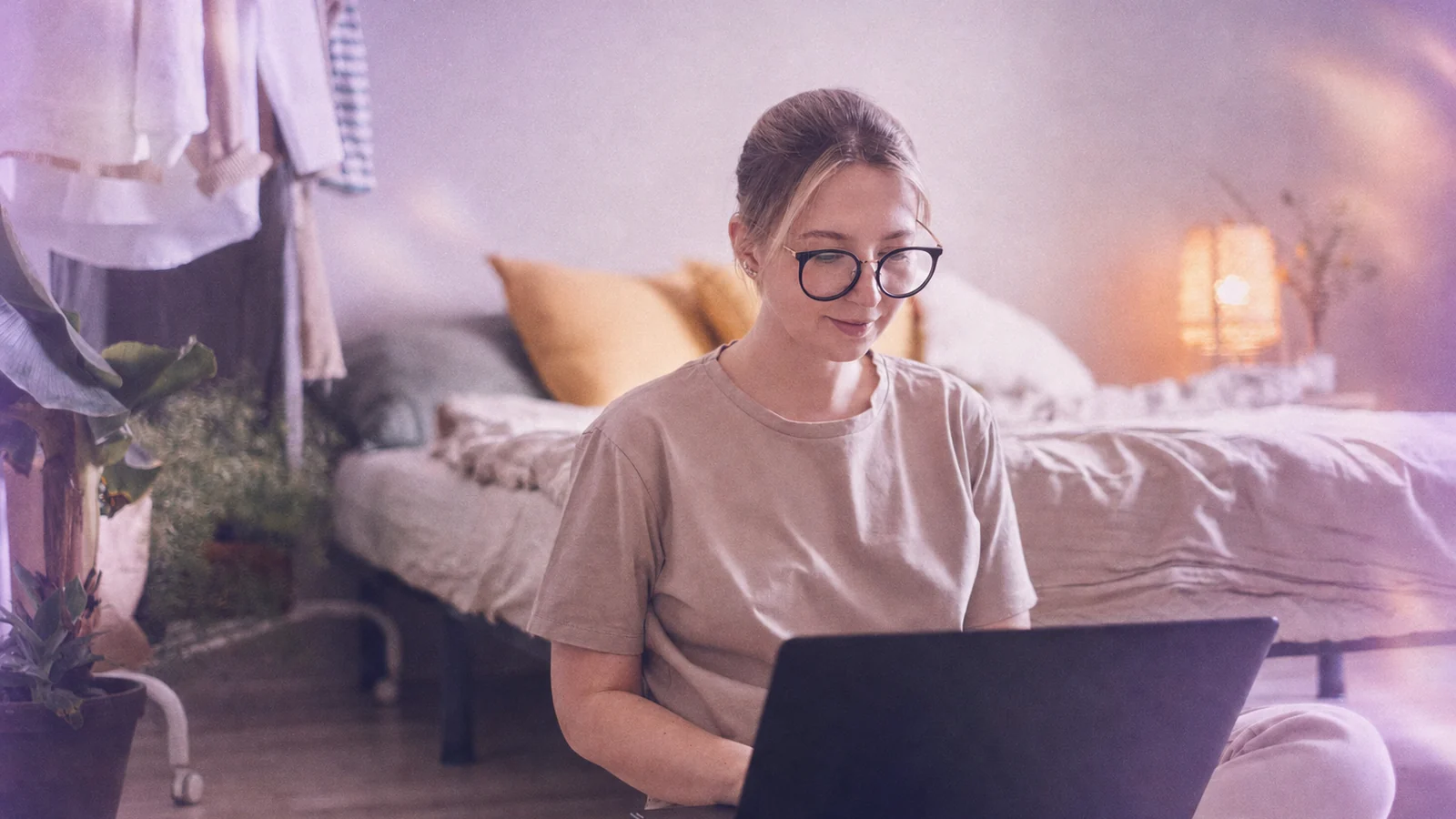 A behavior analyst writing session notes on a laptop