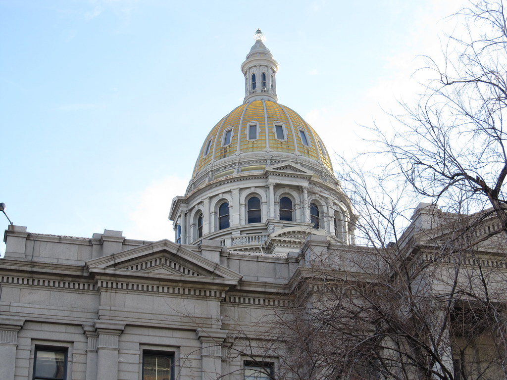 The gold dome of the Colorado State Capitol in Denver