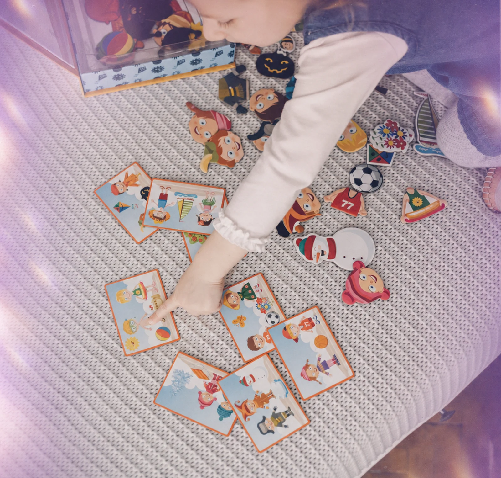 A child using picture cards to communicate