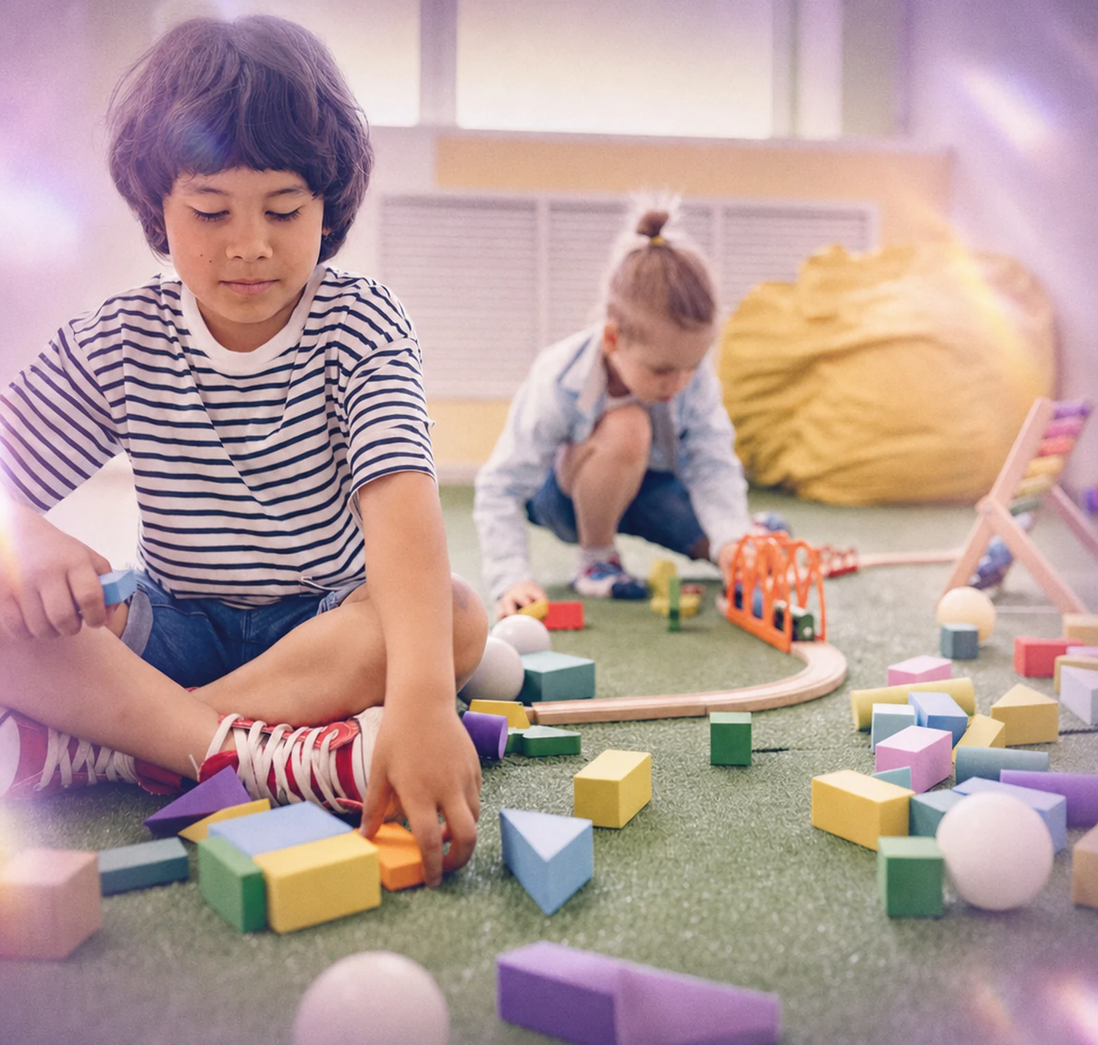 Children playing with blocks in a daycare classroom