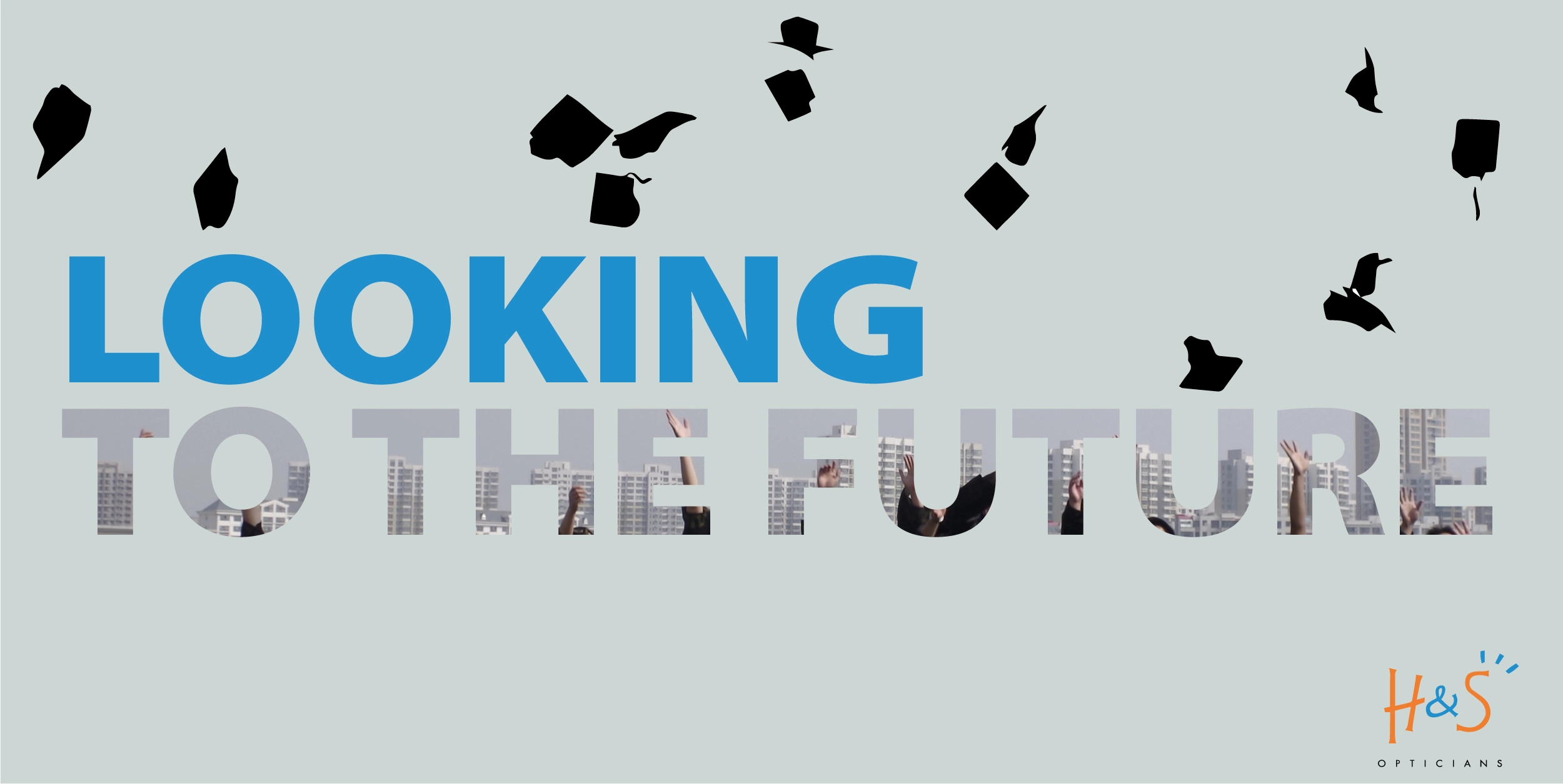 Graduation caps flying in the air above the words ‘Looking to the Future’ alongside the Haine & Smith Opticians logo
