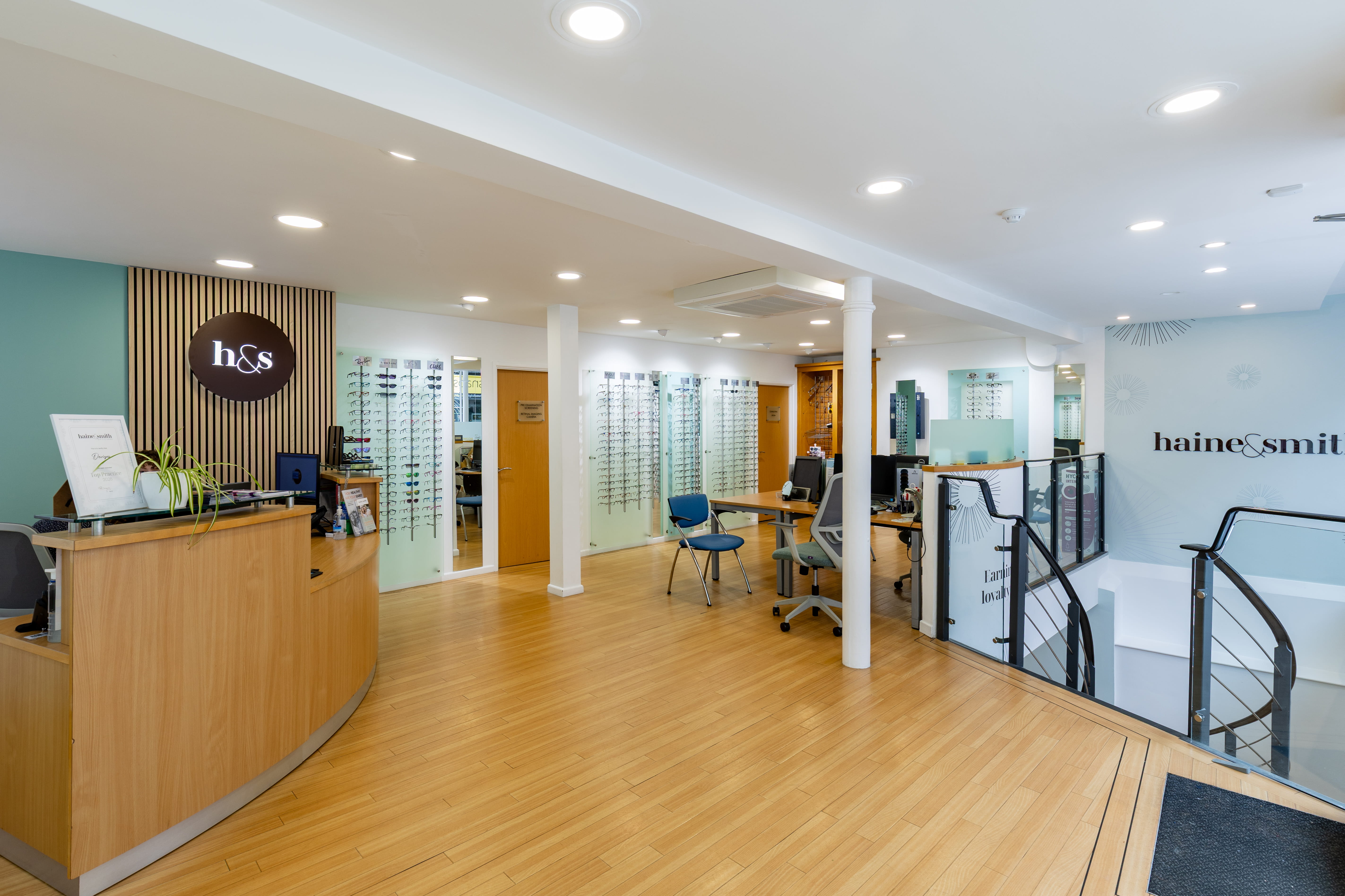 Spacious and modern Haine & Smith Opticians practice interior featuring a reception desk, consultation areas, eyewear displays, and a welcoming environment for eye care appointments