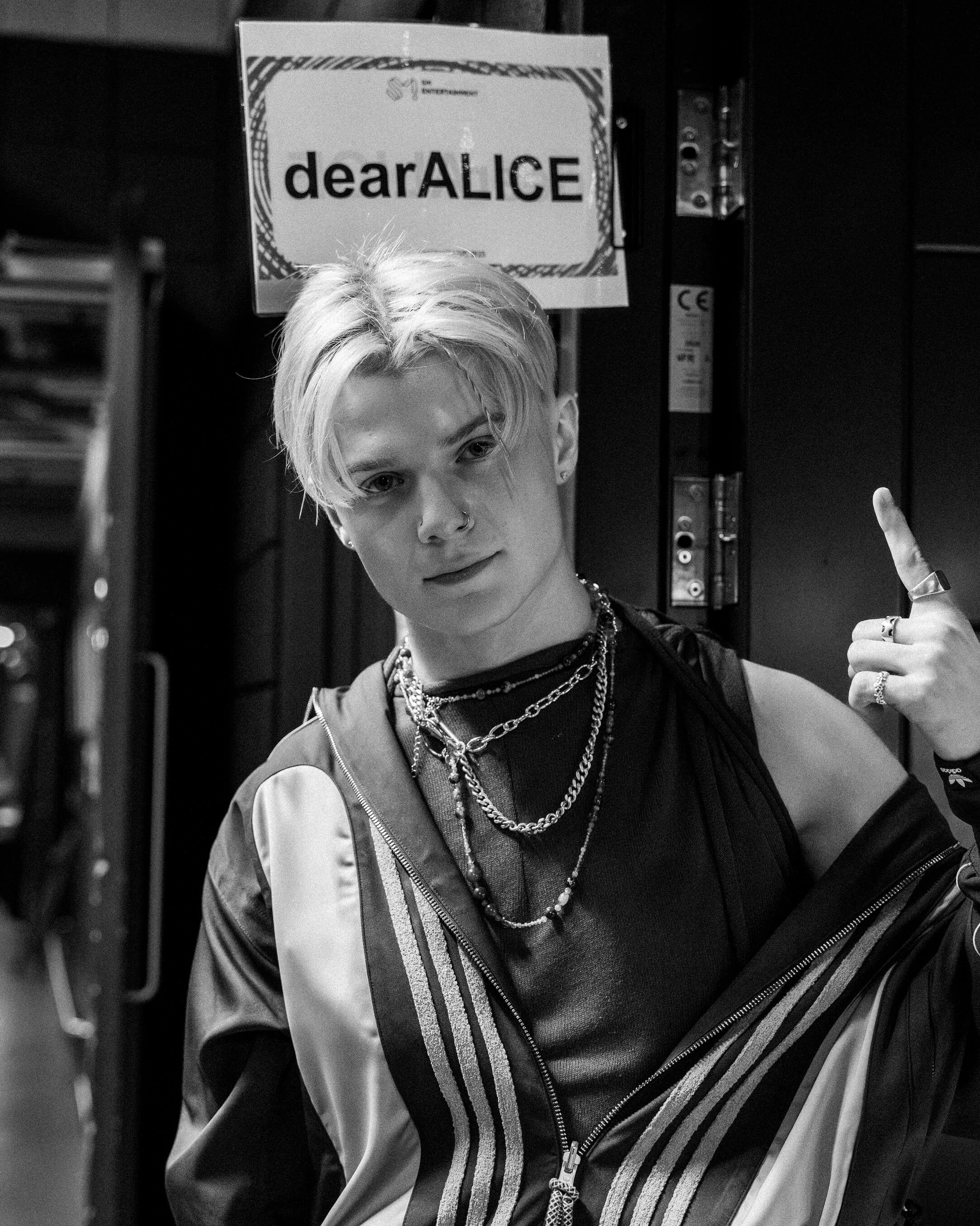 James Sharp of dearALICE poses back stage in a black and white photo