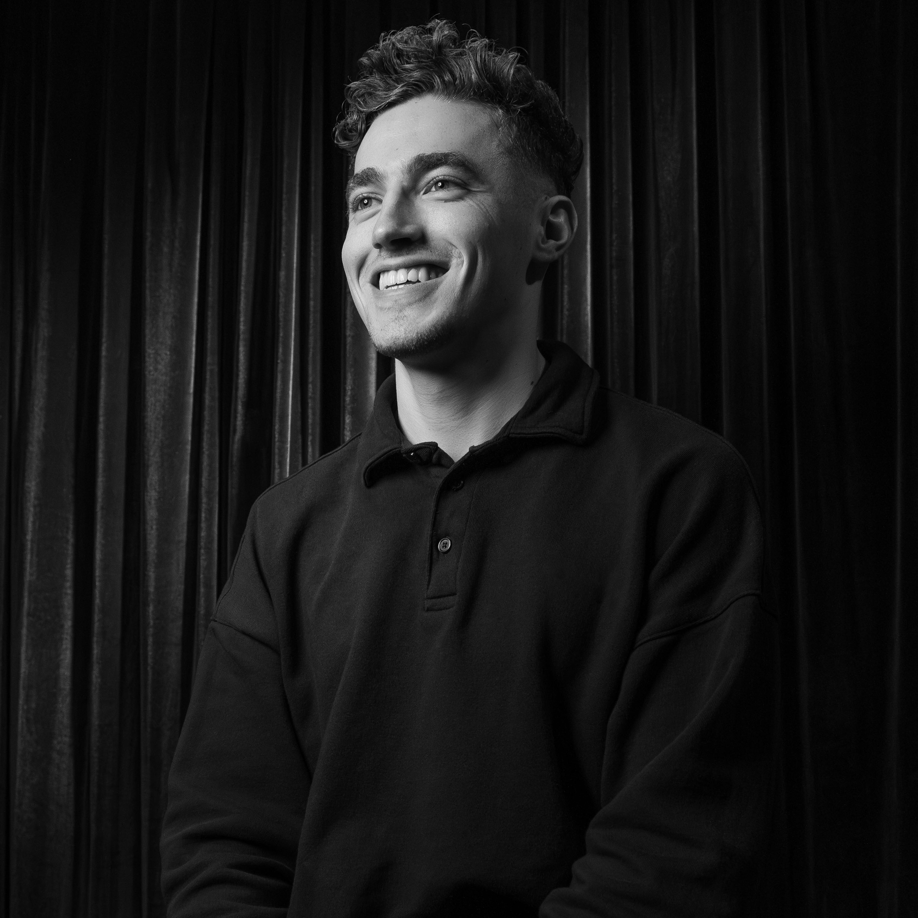 Photographer, Eli Bell, sits for his photo— taken in West Yorkshire