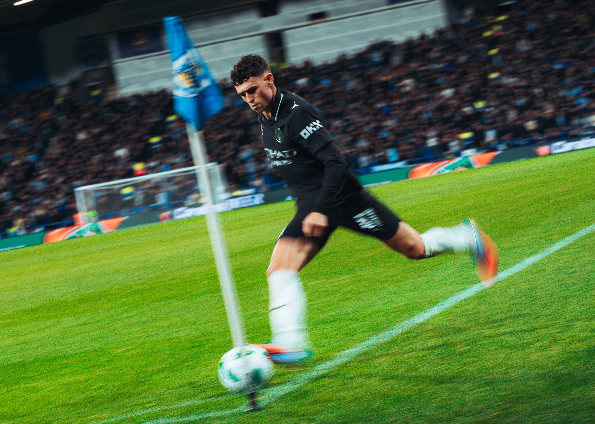 Phil Foden takes a corner at the Accu Stadium