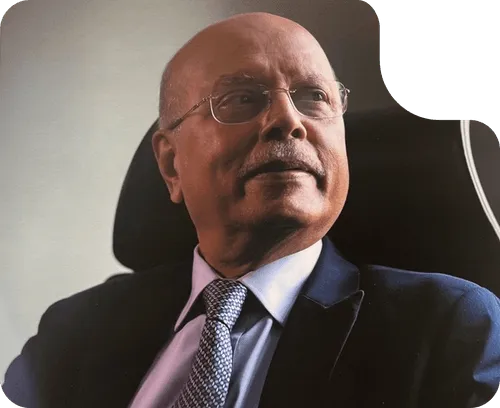 Shailesh Haribhakti, Mentor and Co-Founder of GovEVA, ESG and sustainability advocate with decades of leadership, seated in a suit looking to the side.