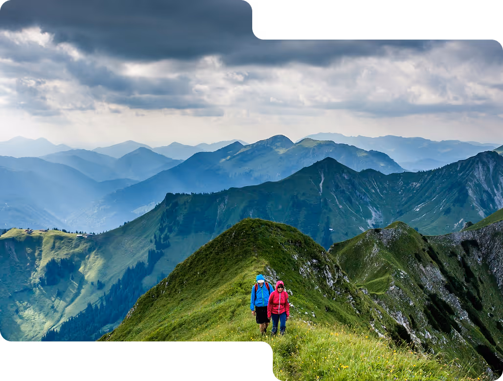 ovEVA guiding businesses through ESG compliance, corporate governance, and sustainability challenges, represented by hikers navigating a steep mountain path