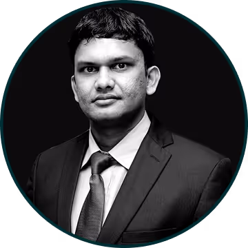 Portrait of a man in a suit against a dark background