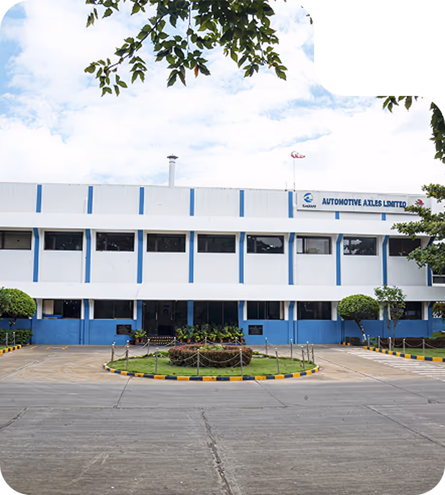 Large industrial facility with trees in the foreground