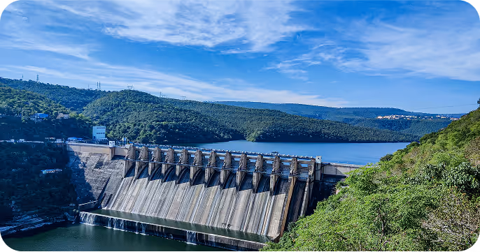 Dam structure surrounded by hills and water