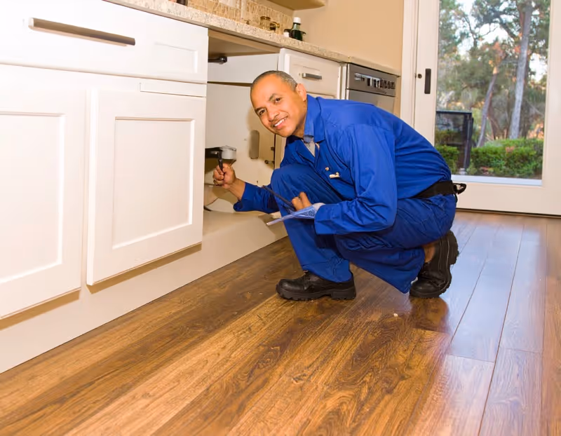 Professional plumbing leak detection Orlando service showing moisture meter identifying pipe leak in Winter Garden home