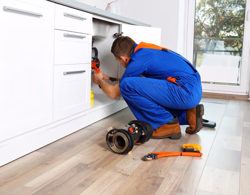 Professional garbage disposal repair service by Brightwater Plumbing technician in Orlando FL