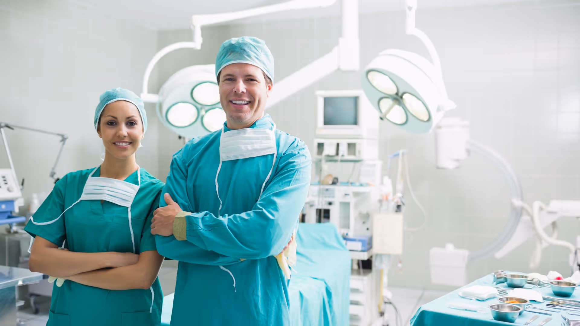 Two private surgeons in surgery room smiling
