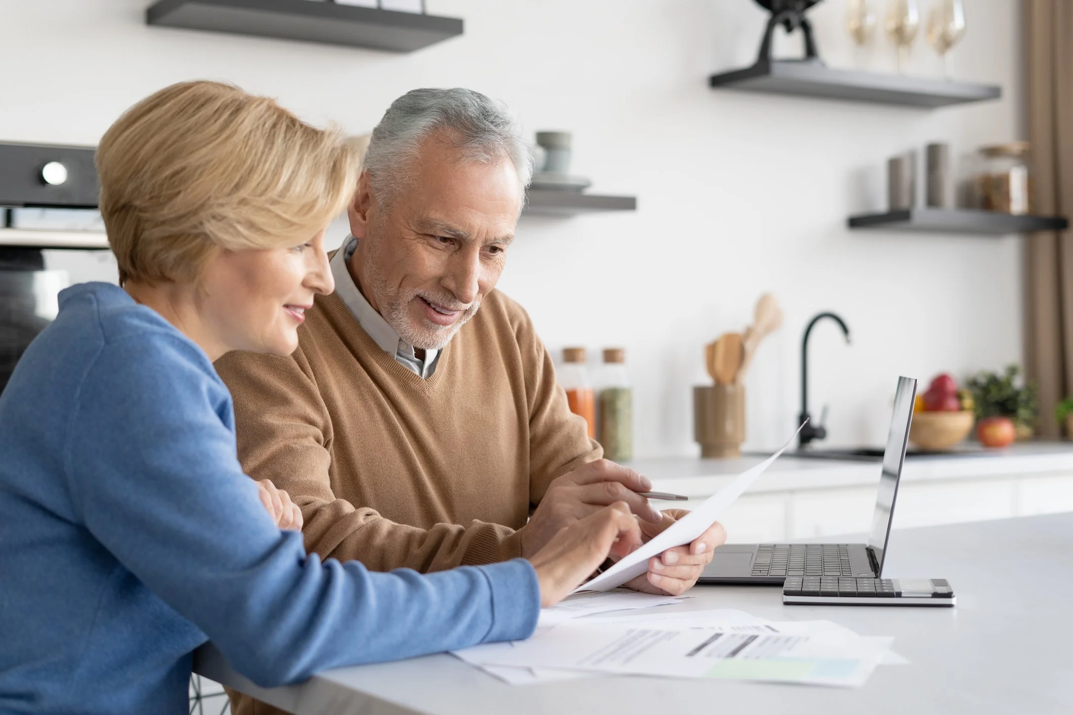 A couple reviews their financial statements together