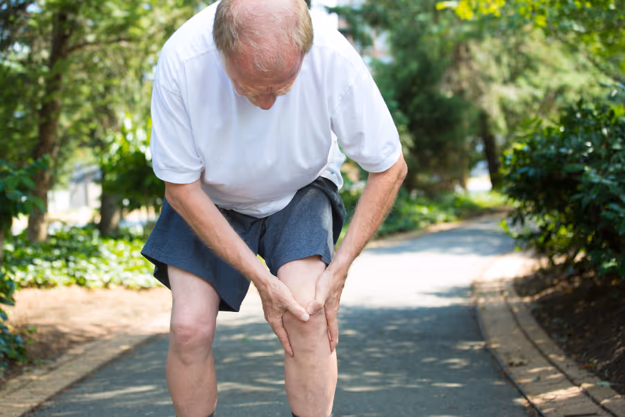 older man with knee pain