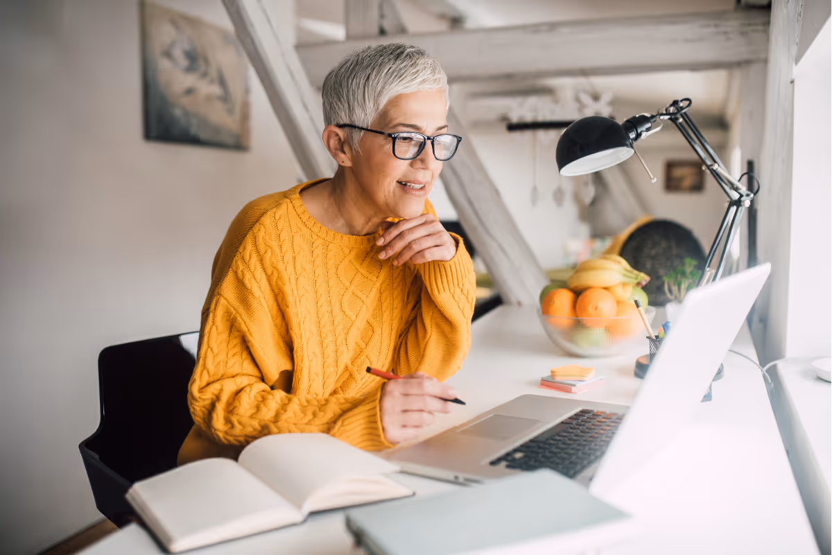 Woman closely looking at computer