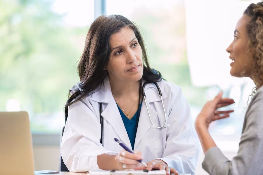 surgeon consulting with patient in office