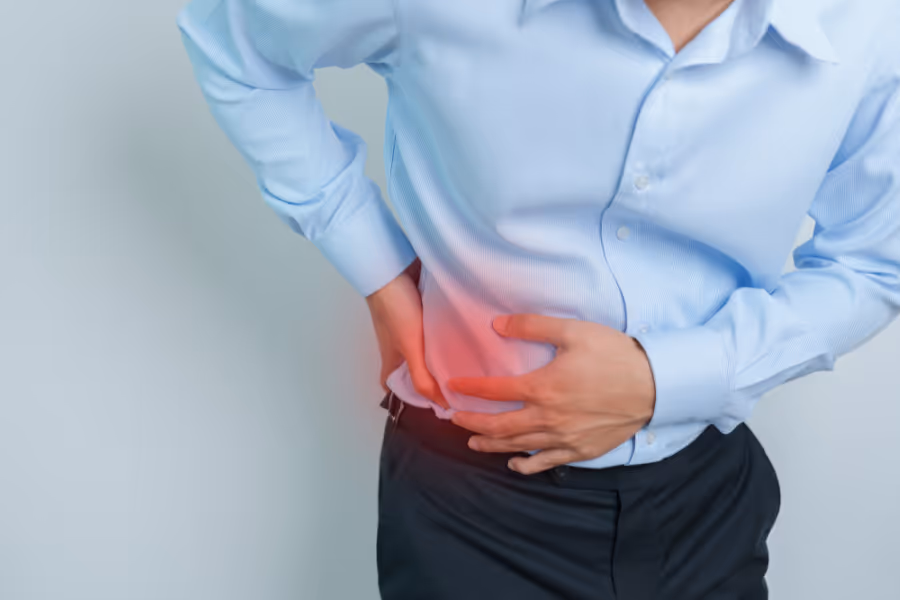 Man bent over in kidney stone pain