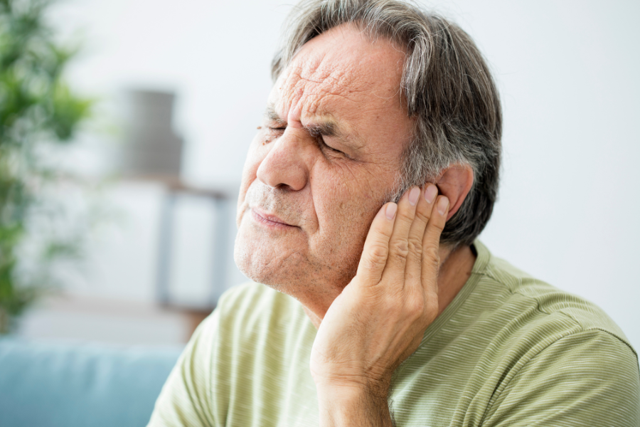 Man in visible ear pain