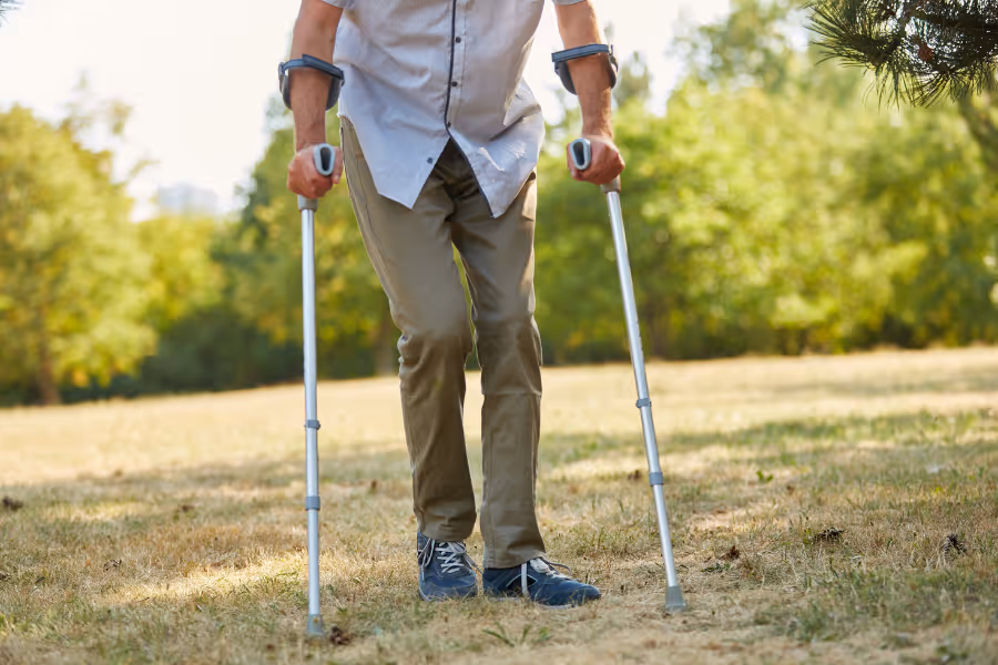 Man walking with the use of crutches