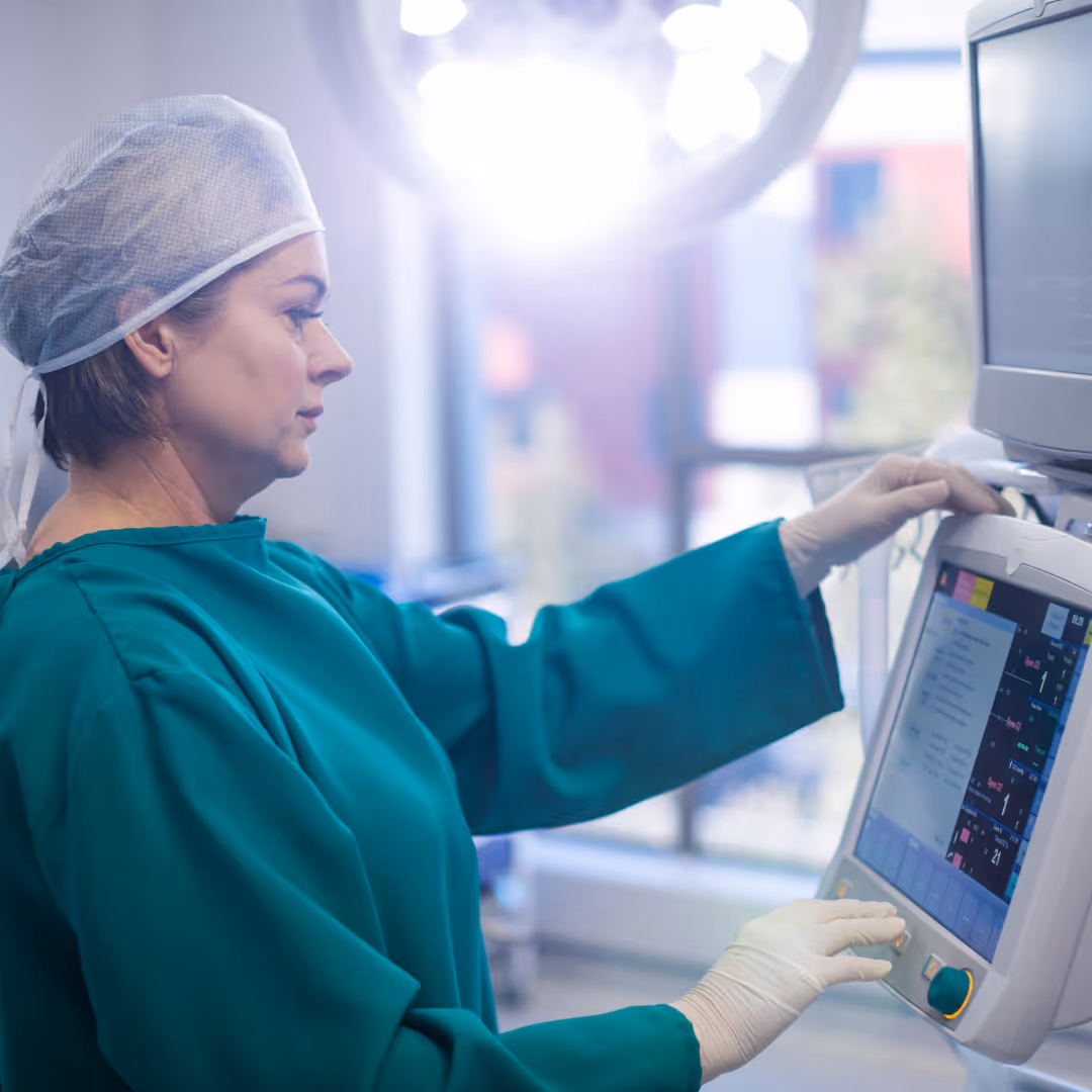 Female surgeon in brightly lit operating room