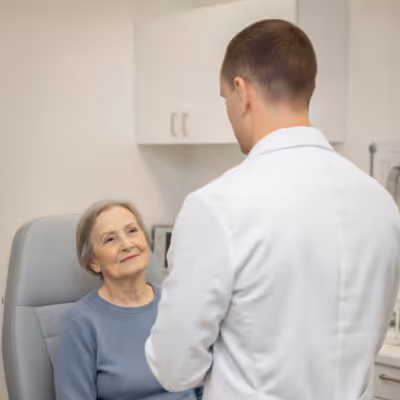 Dr. Alexandre Benny with an older patient in a clinic