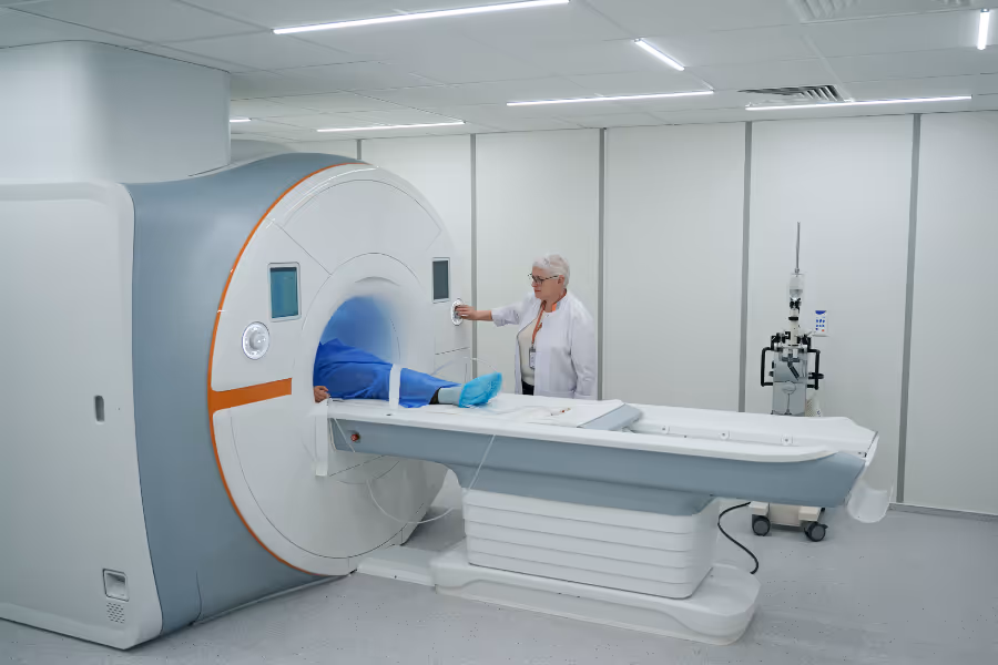 Private MRI being used on a patient in blue scrubs