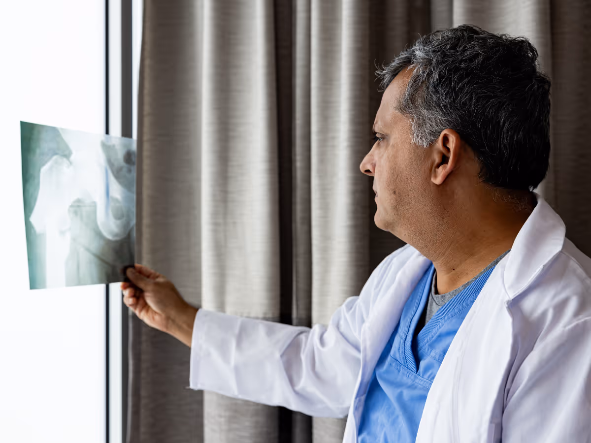 Private orthopedic surgeon examning an xray