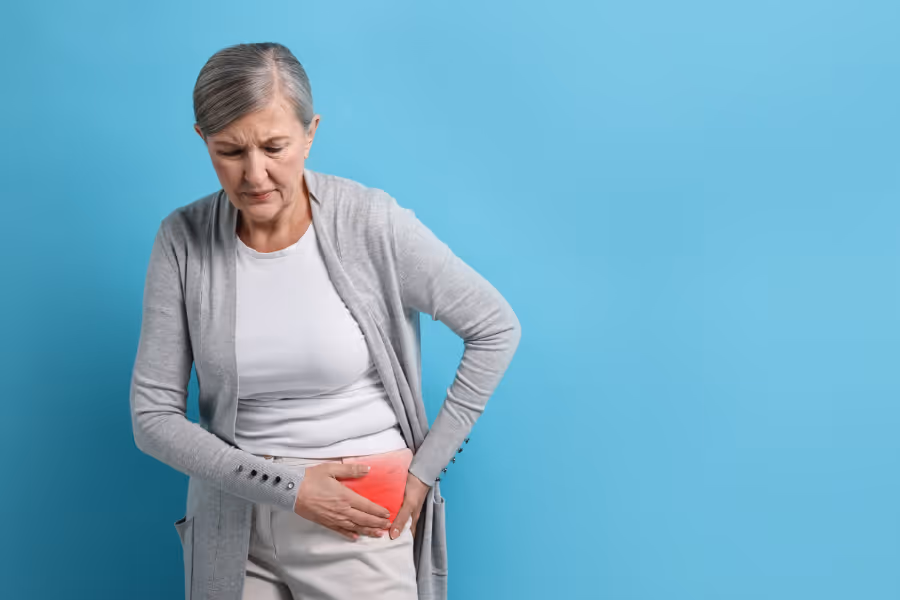 Woman holding her buttock in pain due to bursitis after hip replacement