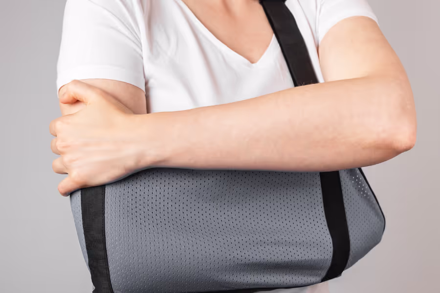 Man wearing a shoulder brace post surgery