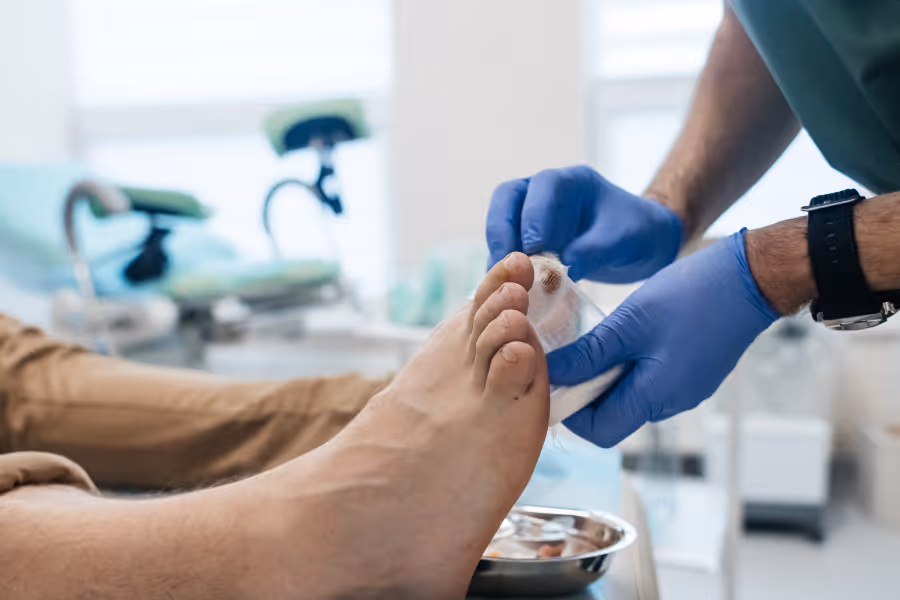 Surgeon preparing big toe for surgery